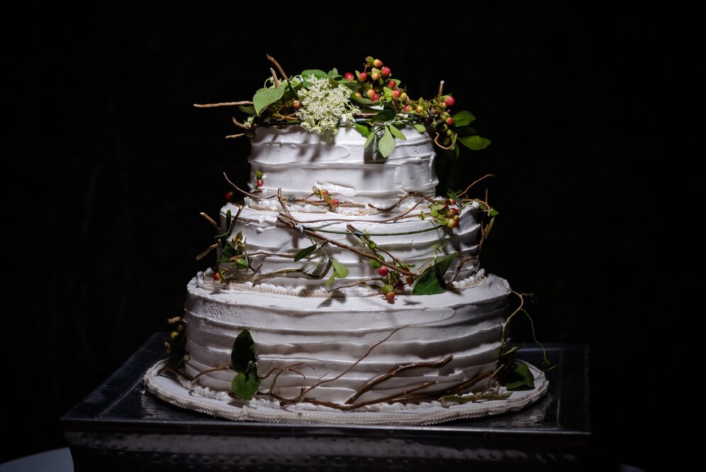 An elegant, tiered cake with a subtle floral design, perfect for a sophisticated event.