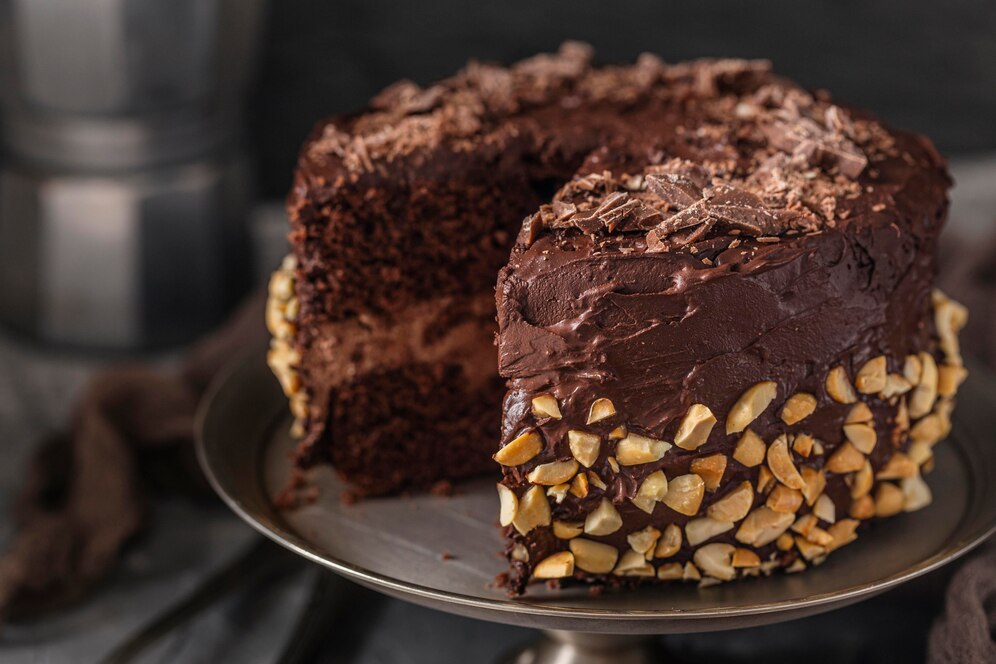 A rich, decadent chocolate cake with smooth ganache and decorative finishing touches.